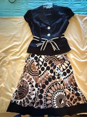 Black Peplum Blouse with Striped Belt & Geometric Print Skirt